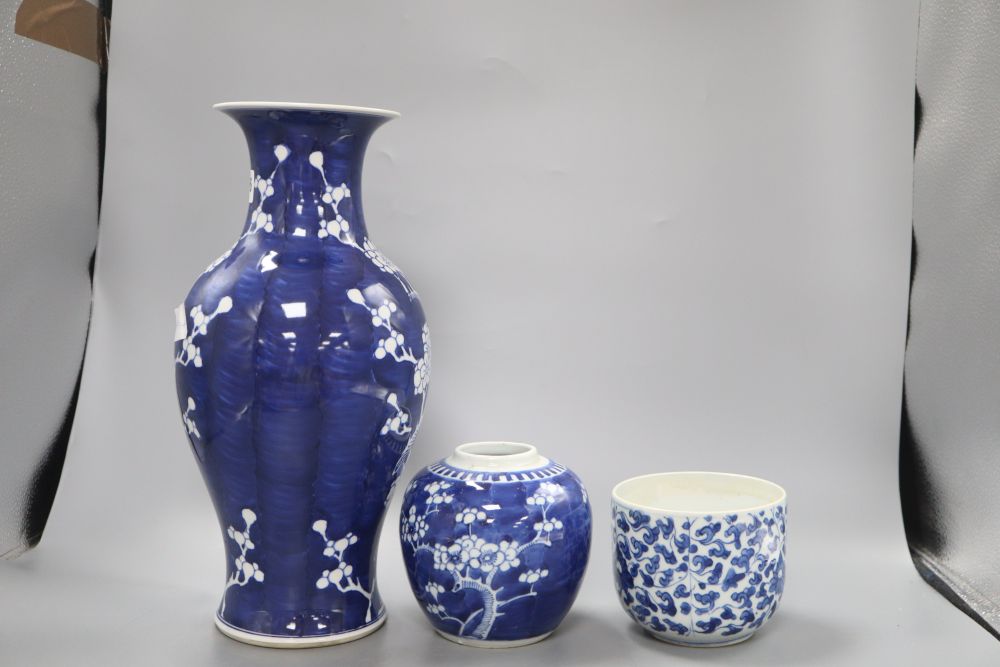 A Chinese blue and white prunus vase, height 36.5cm, jar and a kangxi blue and white jar (lacking cover)